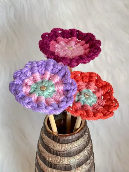 A trio of colorful macrame flower sticks. I can make these in any color you can dream of to match your decor perfectly.