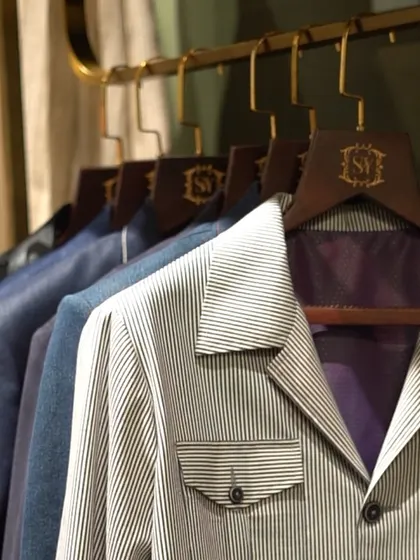 From daytime meetings to evening events, this style suits every occasion. A rack of versatile jackets, including a modern striped piece with utility pockets, ready for any setting.