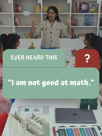 A promotional image for a workshop, featuring me interacting with children. The text overlay 'I am not good at math' highlights the common mindset I aim to change through my work.