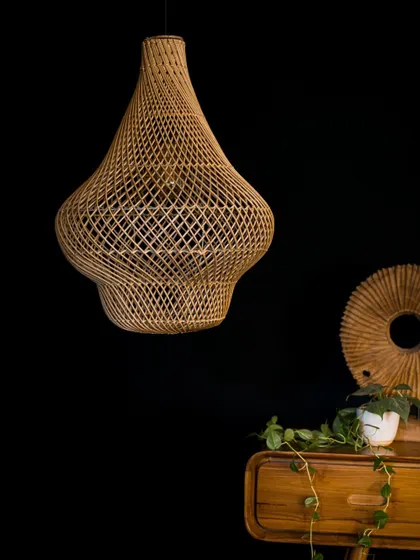 The unlit view of the gourd-shaped lamp highlights its beautiful, swelling form and the intricacy of its diamond-patterned weave. It stands as a beautiful object even when not illuminated.