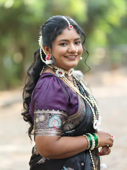 A close-up of the special 'halwyache dagine' or sugar jewellery, traditionally worn for Makar Sankranti. I offer these delicate, handcrafted sets to complete your festive look, along with a classic black saree.