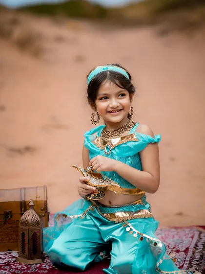 Princess Jasmine with her magic lamp. We provide authentic costumes and props to make your child's princess dreams come true.