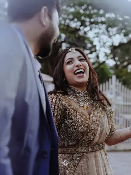 A moment of pure, uninhibited laughter between a couple, showcasing the kind of authentic emotion I love to capture.