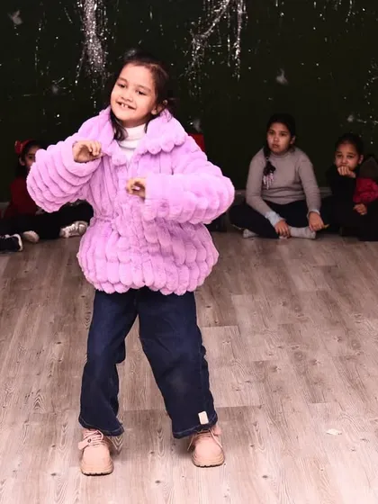 One of our youngest students showing off her moves during the Christmas party. Our celebrations are for every member of the family.