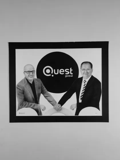 The finished Quest Global portrait hanging on a wall.