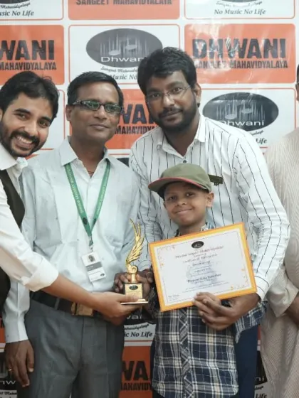 Our faculty team presents an award to a young, talented student.
