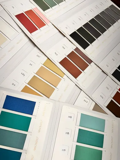 Color cards from our 'Absoluto' fabric line, showcasing a rainbow of options for suits, blazers, and trousers.