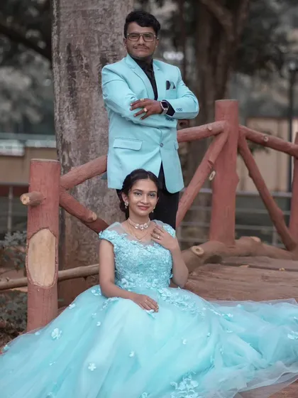 A posed shot from the same series, with the bride seated to show the full skirt of her fairytale gown.