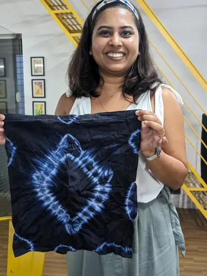 A participant with her beautiful, indigo-dyed tie-dye piece. The patterns created are always a wonderful surprise.