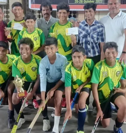 The team with their trophy after a superb comeback victory in the Mt. Carmel Rink Hockey tournament final.