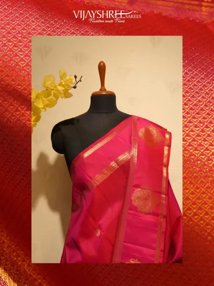 A bright pink Kanjivaram with gold buttas and a traditional border, perfect for the Gowri Ganesh festival.