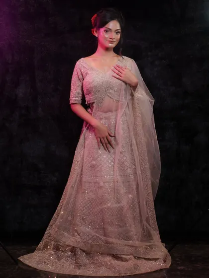 This pose captures the elegance of the outfit and the radiant glow of the makeup.