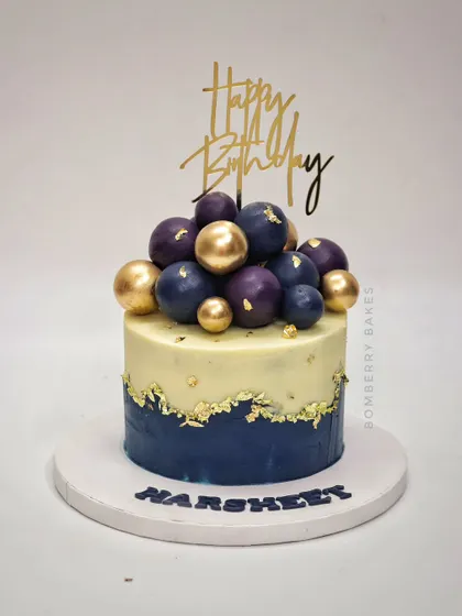 A similar design in navy blue and gold, with purple and gold spheres for a touch of royalty.