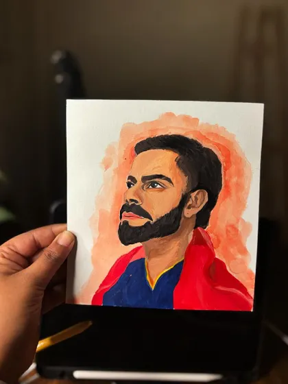 Holding the Virat Kohli birthday portrait, showing its size.