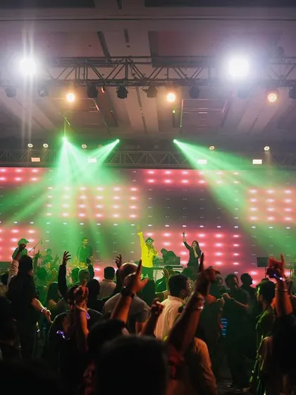 The green stage lights creating an incredible vibe. The light show is synced with our music to create a complete sensory experience.