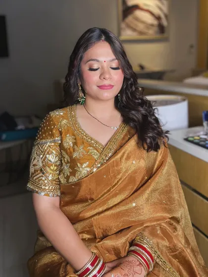 A close-up of the golden glam look, showing the beautiful shimmer on the eyes and the flawless base.