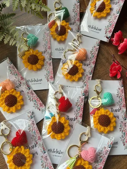 More of our sunflower keychains being prepared for a custom wedding favor order. We can add custom tags and messages for your special day.