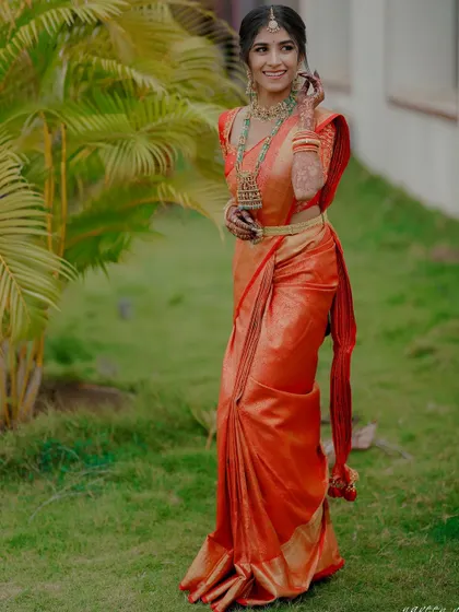 A full-length shot of the bride, looking graceful and happy.