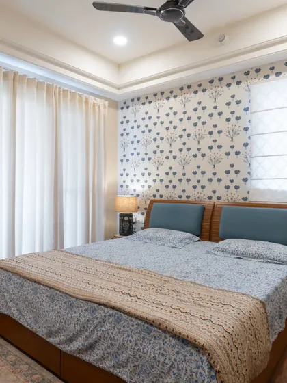 Another angle of the print-focused bedroom, showing how the natural light from the window makes the space feel bright and airy.