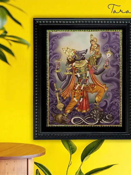Our Varaha Lakshmi Tanjore painting adds a touch of divine power and elegance to this room. The artwork serves as a unique and spiritual statement piece against the bright, modern wall color.