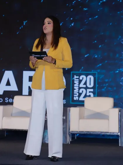 Reviewing my notes on stage at the Cyberguard Summit. I come prepared to discuss topics like data security, AI, and the future of technology, ensuring I'm a knowledgeable guide for the event.