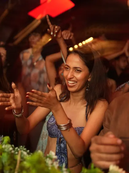 Clapping along to the beat. The crowd's participation is what makes the party.