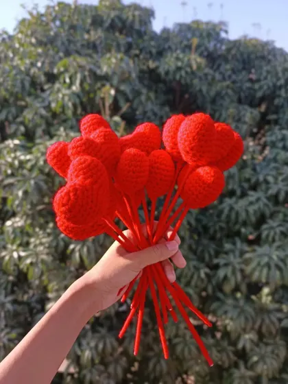 A handful of red heart-shaped flower stems.