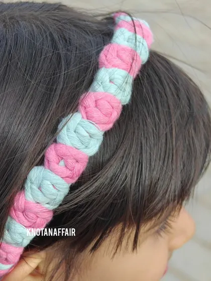 A close-up of the macrame rose flower hairband being worn. It’s a comfortable and stylish accessory for kids and adults alike.