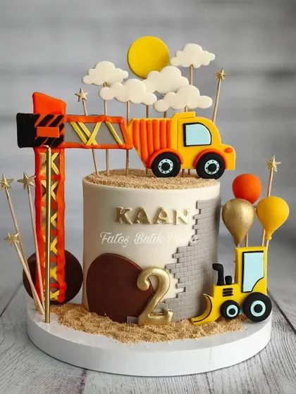 A cute construction-themed cake with intricate details, perfect for a toddler's birthday.