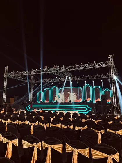 This is a stage built for performance. For this sangeet night, we constructed a large metal truss system equipped with professional spotlights and a custom LED backdrop, ready for a night of music and dance.