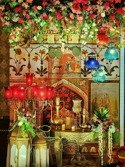 We specialize in creating rich, thematic experiences like this authentic Sufi Night setup. The decor features traditional Mughal art panels, ornate brass lanterns, and deep-hued florals to evoke a soulful and mystical ambiance for your special event.