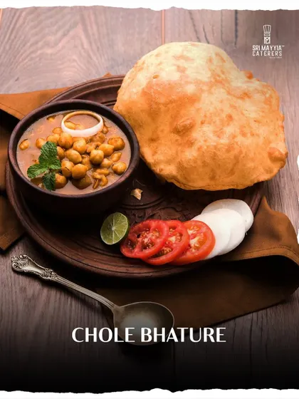 A North Indian classic, our Chole Bhature is a hearty and flavorful dish that always delights. Fluffy, hot bhature are served with spicy chickpea curry, making it a perfect addition to any festive menu.
