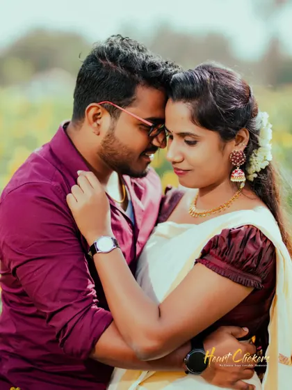 A close and intimate pre-wedding portrait. The focus is entirely on the couple's connection and the soft emotion between them.
