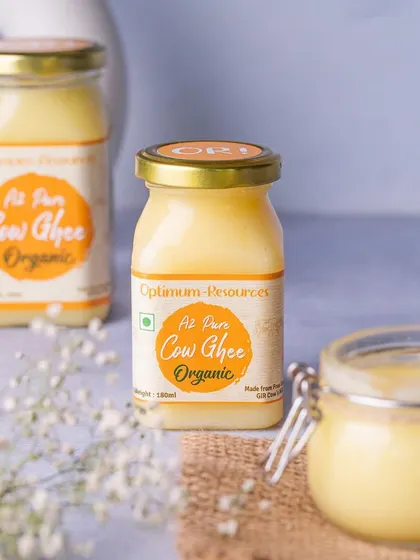 A clean and bright product shot of A2 Cow Ghee jars. This style is ideal for e-commerce listings, providing a clear and attractive view of the product and its packaging.