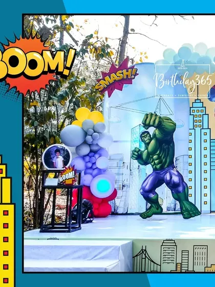 Another angle of the action-packed superhero stage, showing the Hulk and Spider-Man props ready for a party battle.