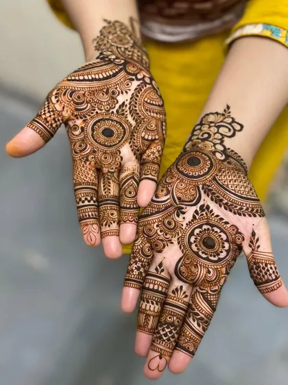 Two hands with similar but not identical designs, showcasing a mix of mandalas and other traditional patterns. Perfect for a bride and her sister or best friend.