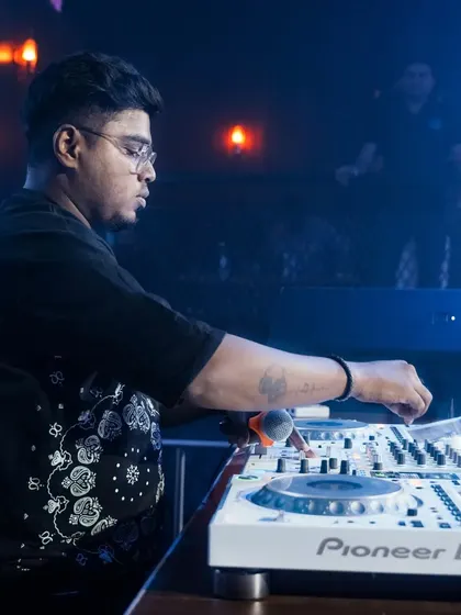 Another angle of me at work, showing my hands on the Pioneer DJ mixer. This is where the technical skill of beat-matching and mixing comes into play.