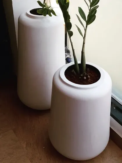 Your entrance sets the first impression for your entire home. For this foyer, I chose these sleek, modern white planters to create a clean and welcoming vibe. Paired with hardy, easy to care for plants, they make the space feel fresh and bright the moment you walk in.
