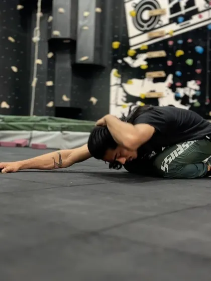 The child's pose with rotation is a key part of our thoracic opener routine. It helps improve spinal mobility and release tension in the upper back.