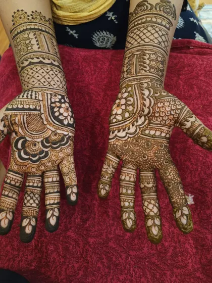 Here's a design with strong contrast, using bold, filled-in shapes against delicate patterns. This technique makes the primary motifs, like the flowers and paisleys, really stand out.