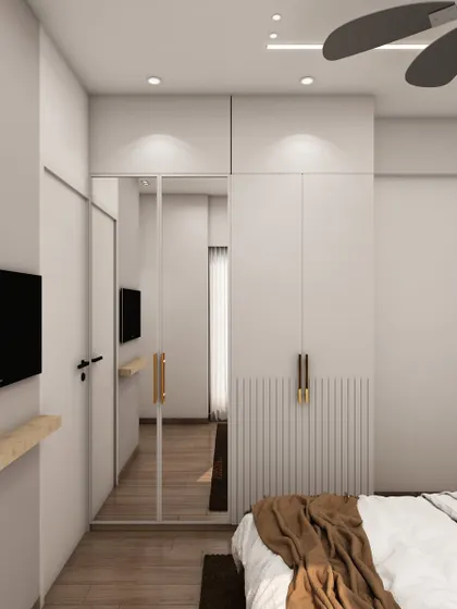 This view shows the minimalist wardrobe with a full-length mirror, which helps to make the room feel more spacious and bright.