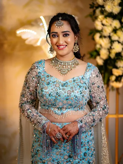 A beautiful portrait of Supriya, showcasing her flawless makeup and stunning reception jewelry.