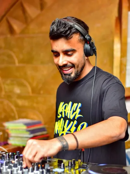 A smiling shot of me at the decks at Secret Story. I'm in my happy place when I'm mixing tracks and seeing the crowd enjoy it.