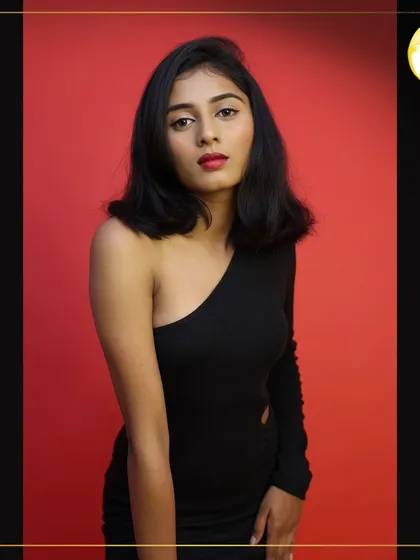 A full-body shot showing how the classic makeup look pairs with a modern, one-shoulder dress. This style is versatile and works for many types of commercial or portfolio shoots.