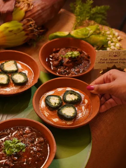 A selection of our modern Indian dishes, including Palak Paneer Kofta in a rich makhani gravy. Served in traditional earthenware bowls, this dish showcases our ability to elevate classic Indian cuisine.