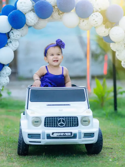 Pre-birthday shoots are so much fun. Here, the birthday girl enjoys her own little ride, creating a playful and memorable outdoor portrait that's full of personality.