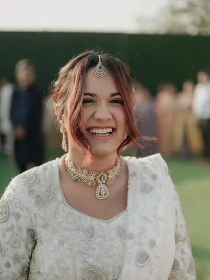 The biggest, happiest smile. Her joy is contagious, and the makeup is designed to look beautiful and effortless.