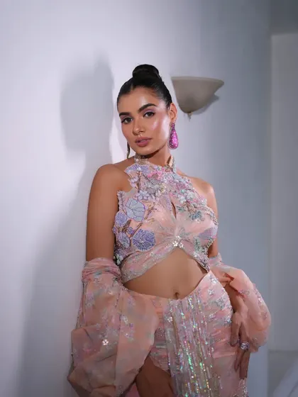 A pastel peach gown with dramatic, floor-length balloon sleeves. A true statement piece.