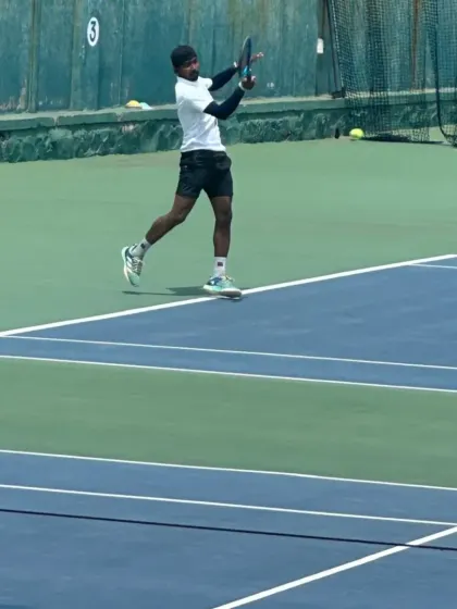 Coach Raju executing a flawless backhand during a tournament. Perfect technique is something we drill into all our high-performance players.