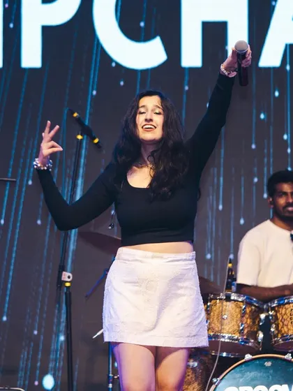 Feeling the music with my amazing drummer holding down the beat. The energy between the band members on stage is what makes our live shows so special.